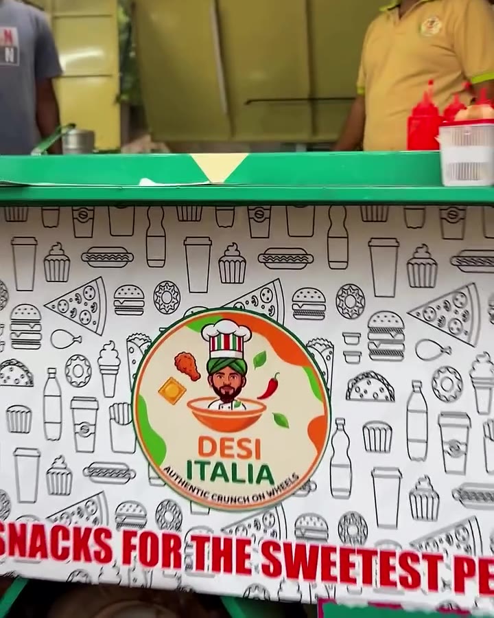 Side of the DESI ITALIA truck: the round logo on a white doodle wrap above a red stripe reading “Hot snacks for the sweetest people”